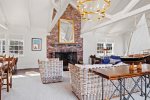 A floor to ceiling brick fireplace anchors the room